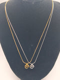 Collier chaîne serpent fine avec pendentif ne sculpté en relief